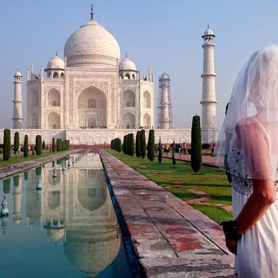 Woman Travels The World in Her Wedding Dress After Divorce