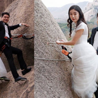 Chinese Couple Climbs Dangerous Mountain To Have Their Wedding Photos
