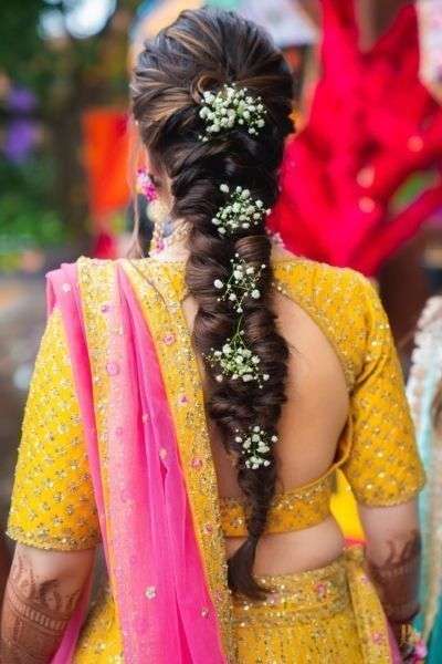 Braids + curls and pretty blooms = Beautiful Bridal Hairstyle❤ If you are  looking for mehendi hairstyle or haldi hairstyle ideas then save… |  Instagram