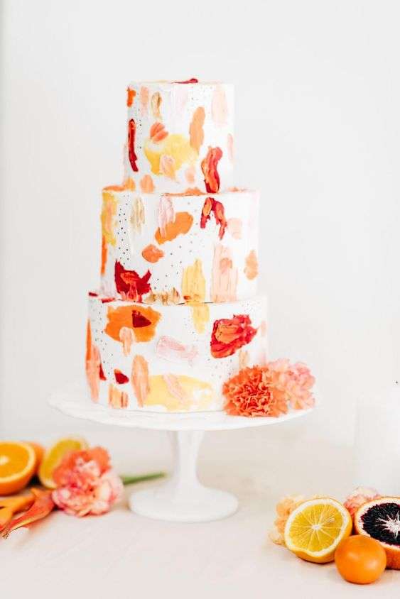 White and orange wedding cake